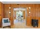 Entryway with wood wall paneling, parquet flooring, and view of dining room at 716 14Th Ne Ave, St Petersburg, FL 33701