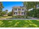 Charming two-story home with manicured landscaping and a welcoming front porch at 716 14Th Ne Ave, St Petersburg, FL 33701