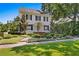 Beautiful two-story home with a well-maintained lawn and lush landscaping at 716 14Th Ne Ave, St Petersburg, FL 33701