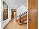 Hallway with wood flooring, staircase, and mirror at 716 14Th Ne Ave, St Petersburg, FL 33701