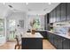 Modern kitchen with dark cabinetry and marble countertops at 716 14Th Ne Ave, St Petersburg, FL 33701
