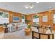 Spacious living room with wood walls, comfy seating, and stylish decor at 716 14Th Ne Ave, St Petersburg, FL 33701