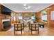Spacious living room with wood walls, fireplace, and hardwood floors at 716 14Th Ne Ave, St Petersburg, FL 33701