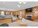 Living room with wood paneled walls, fireplace and hardwood floors at 716 14Th Ne Ave, St Petersburg, FL 33701