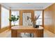 Home office with wood paneled walls, large windows, and a unique desk at 716 14Th Ne Ave, St Petersburg, FL 33701