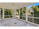 Spacious screened porch with stone tile flooring at 716 14Th Ne Ave, St Petersburg, FL 33701