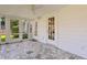 Relaxing screened porch with flagstone floor and French doors at 716 14Th Ne Ave, St Petersburg, FL 33701