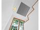 Bright stairwell with unique light fixtures and wood accents at 716 14Th Ne Ave, St Petersburg, FL 33701
