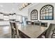 Bright dining room with kitchen view, and stylish light fixture at 3134 Francoa Dr, Odessa, FL 33556