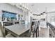 Open dining room with a view into the kitchen and breakfast bar at 3134 Francoa Dr, Odessa, FL 33556