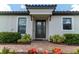 Inviting home exterior with a landscaped walkway leading to the front door at 3134 Francoa Dr, Odessa, FL 33556