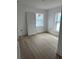 Bright bedroom with wood floors and window at 316 11Th N Ave, St Petersburg, FL 33701