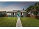 Renovated craftsman home with gray siding and teal door at 4320 3Rd N Ave, St Petersburg, FL 33713
