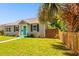Charming bungalow with teal door and well-manicured lawn at 4320 3Rd N Ave, St Petersburg, FL 33713