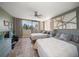 Spacious bedroom with tiled floors, two beds, and access to a private balcony at 5700 Escondida S Blvd # 306, St Petersburg, FL 33715