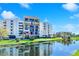 Attractive condo building with water views and lush landscaping at 5700 Escondida S Blvd # 306, St Petersburg, FL 33715