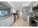 Modern kitchen with granite countertops at 5700 Escondida S Blvd # 306, St Petersburg, FL 33715
