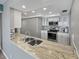 Modern kitchen featuring granite countertops and stainless steel appliances at 5700 Escondida S Blvd # 306, St Petersburg, FL 33715