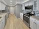 Modern kitchen with granite countertops and stainless steel appliances at 5700 Escondida S Blvd # 306, St Petersburg, FL 33715