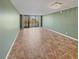 Bright living room with tile floors and sliding glass doors to balcony at 5700 Escondida S Blvd # 306, St Petersburg, FL 33715