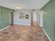 Spacious living room with tile flooring and access to a balcony with water views at 5700 Escondida S Blvd # 306, St Petersburg, FL 33715
