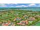 Expansive aerial view of a waterfront community, golf course, and Sarasota Bay with blue skies at 6269 Palma Del Mar S Blvd # 608, St Petersburg, FL 33715