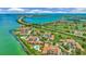 Beautiful overhead view showcases a coastal community with golf course, bridge and aqua waters at 6269 Palma Del Mar S Blvd # 608, St Petersburg, FL 33715