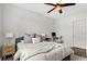 Bright bedroom with a queen-size bed, nightstand, and workspace at 1910 E Palm Ave # 11303, Tampa, FL 33605