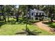 Aerial shot of a home with a spacious, fenced-in backyard and mature trees at 5518 21St S Ave, Gulfport, FL 33707