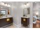 Double vanity bathroom featuring elegant modern vanities with gold hardware and ensuite access at 5518 21St S Ave, Gulfport, FL 33707