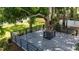 Outdoor living space featuring a custom deck built around a mature tree, perfect for entertaining at 5518 21St S Ave, Gulfport, FL 33707