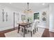 Dining room featuring wood table and four upholstered chairs on top of rug at 5518 21St S Ave, Gulfport, FL 33707