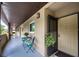 Inviting condo hallway featuring table and chairs with potted flowers, leading to unit #304 at 1245 S Martin Luther King Jr Ave # 304, Clearwater, FL 33756