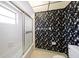 Bathroom with shower, tub, and floral wallpaper at 3934 Venetian Way, Tampa, FL 33634