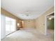 Large bedroom with sliding doors and ceiling fan at 3934 Venetian Way, Tampa, FL 33634