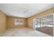 Bedroom with sliding door to pool and ceiling fan at 3934 Venetian Way, Tampa, FL 33634