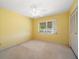 Bright bedroom with window and ceiling fan at 3934 Venetian Way, Tampa, FL 33634