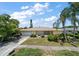 Ranch style home with a landscaped yard and attached garage at 3934 Venetian Way, Tampa, FL 33634