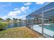 Screened-in pool overlooking the canal at 3934 Venetian Way, Tampa, FL 33634