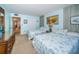 Comfortable bedroom featuring two twin beds with ocean themed bedding and decor, with light blue walls and a dresser at 1235 S Highland Ave # 2-204, Clearwater, FL 33756