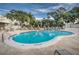 Enjoy a refreshing swim in the community pool surrounded by lush landscaping and plenty of lounge chairs at 1235 S Highland Ave # 2-204, Clearwater, FL 33756