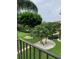 Relaxing balcony view of lush landscaping and trees at 7050 Sunset S Dr # 203, South Pasadena, FL 33707