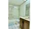 Clean bathroom with tub, shower, and vanity at 7050 Sunset S Dr # 203, South Pasadena, FL 33707