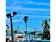 Lovely waterfront view with palm trees and blue sky at 7050 Sunset S Dr # 203, South Pasadena, FL 33707