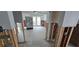 Hallway view with exposed framing and a glimpse into a room under renovation at 2654 45Th S St, Gulfport, FL 33711