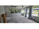 Sunroom with large windows and under renovation, showing new floor tiles at 2654 45Th S St, Gulfport, FL 33711