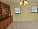 Dining room with wood hutch and tile floor at 119 Stafford Dr, Palm Harbor, FL 34684