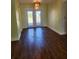 Bright dining room with hardwood floors and French doors at 119 Stafford Dr, Palm Harbor, FL 34684