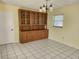 Dining room with wood hutch and tile floor at 119 Stafford Dr, Palm Harbor, FL 34684