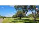 Peaceful view of a lush green golf course at 119 Stafford Dr, Palm Harbor, FL 34684